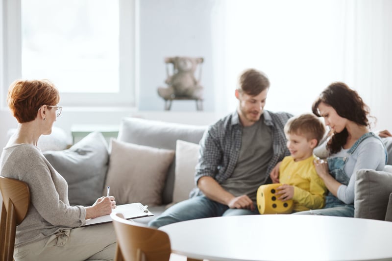 Happy family in therapy