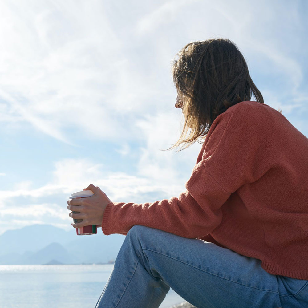 Woman looking out over the water